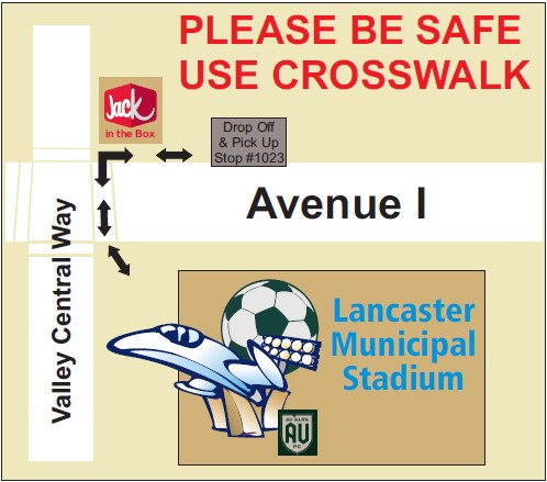 Please be safe, use crosswalk. Graphic showing crosswalk at intersection of Avenue I and Valley Central way, between Jack in the Box and Lancaster Municipal Stadium.