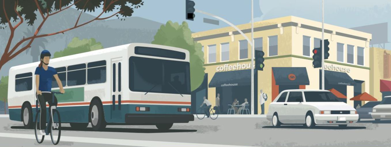 Clipart depicting a bus at an intersection and a person riding a bicycle on the sidewalk.