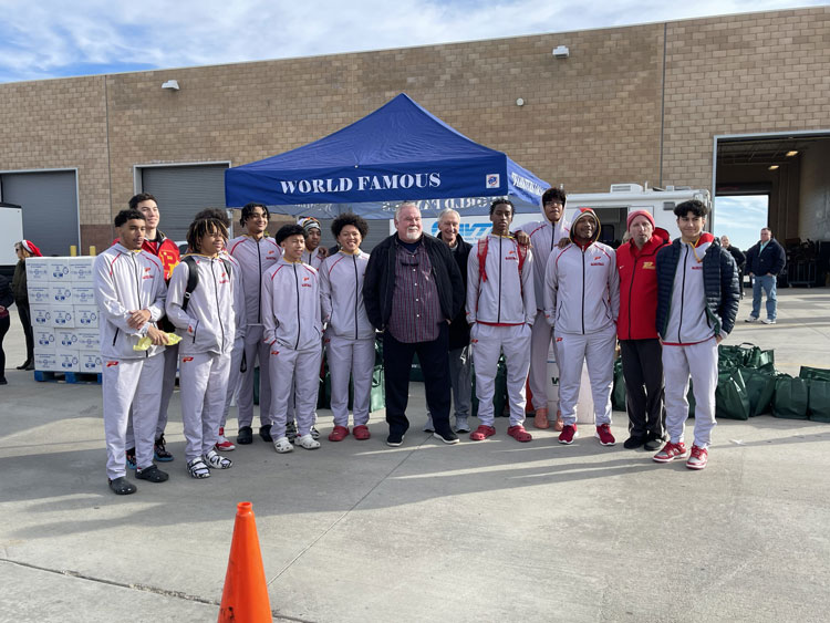 Marvin Crist with Student Athletes from Paraclete High School.
