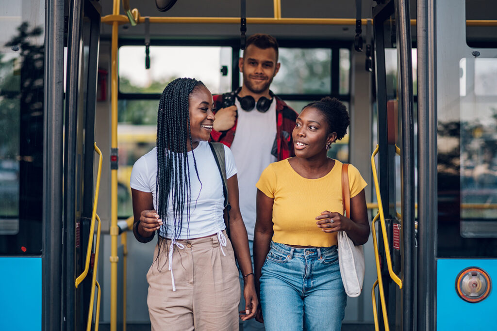 Patrons exiting bus through the double doors.