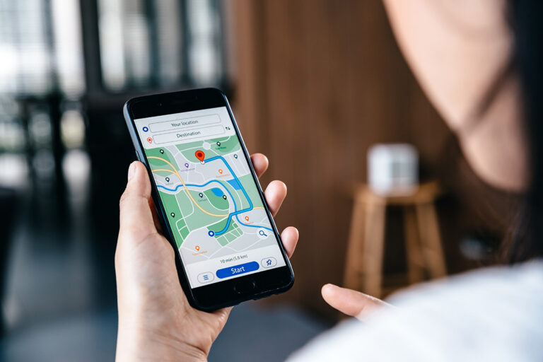 A patron planning their trip using their cell phone with a map displayed.